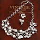Silver faux-pearl leaf jewelry set with matching necklace and earrings, crystal leaf links