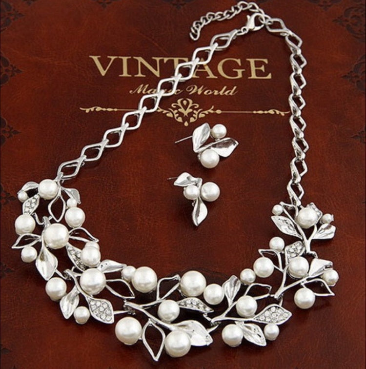 Silver faux-pearl leaf jewelry set with matching necklace and earrings, crystal leaf links
