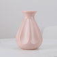 Pink plastic vase with fluted teardrop silhouette, 14 x 20 cm