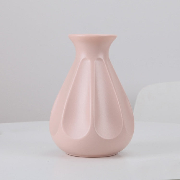 Pink plastic vase with fluted teardrop silhouette, 14 x 20 cm