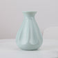 Blue plastic vase with fluted teardrop design, 14 x 20 cm