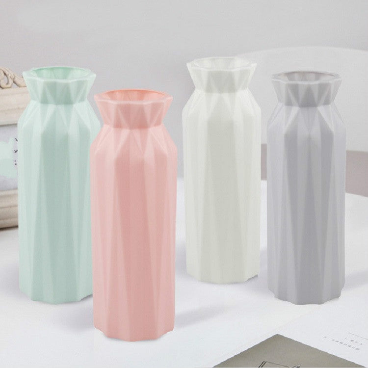 Pastel plastic round vases set: light green, pink, white, and gray with faceted sides