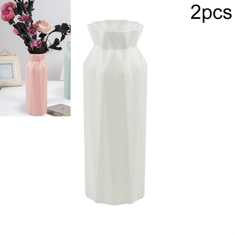 White plastic round vase with faceted sides and flared rim, tall cylinder shape