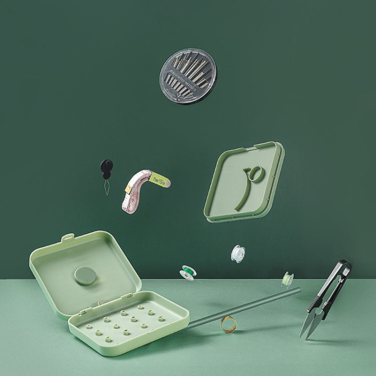 Magnetic sewing storage box, mint green, open case with sewing tools