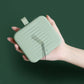 Magnetic sewing storage box, mint green, held open showing needles