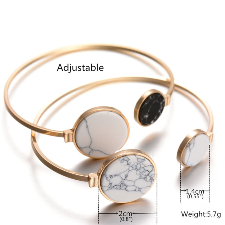 Gold-tone round cuff bangles with white and black faux marble discs