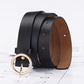 Black PU waist belt with round gold-tone buckle and tan interior lining