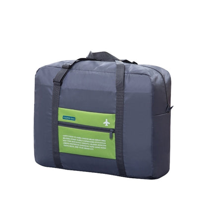 Navy folding travel bag with lime green label panel and zipper closure, top handles