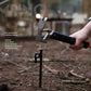 Black camping hammer with claw head and stake-puller accessory, red lanyard