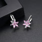 Pink and clear flower-shaped cubic zirconia stud earrings with silver-tone hoops