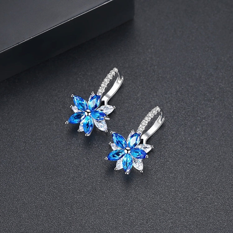 Blue and clear flower-shaped cubic zirconia stud earrings with silver-tone huggers