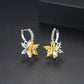 Yellow and clear flower-shaped cubic zirconia stud earrings with silver-tone backs