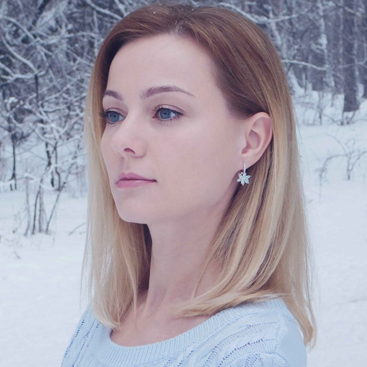 Flower stud earrings with light blue and clear cubic zirconia stones