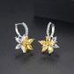 Yellow flower stud earrings with clear cubic zirconia petals and hoop-like hinge backs