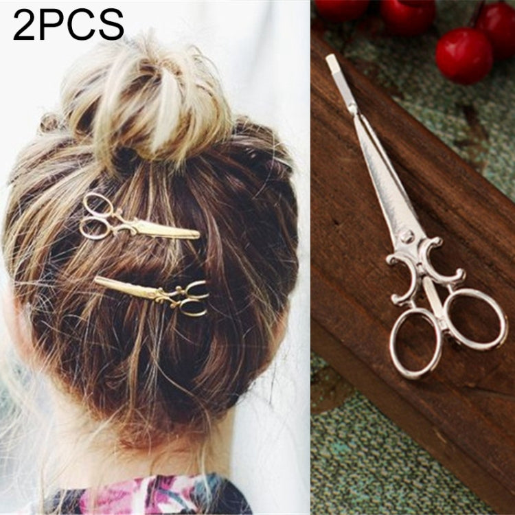 Silver hair clips (2-pack) with swirl design, worn on a low bun
