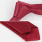 Red slim necktie with textured weave, folded close-up