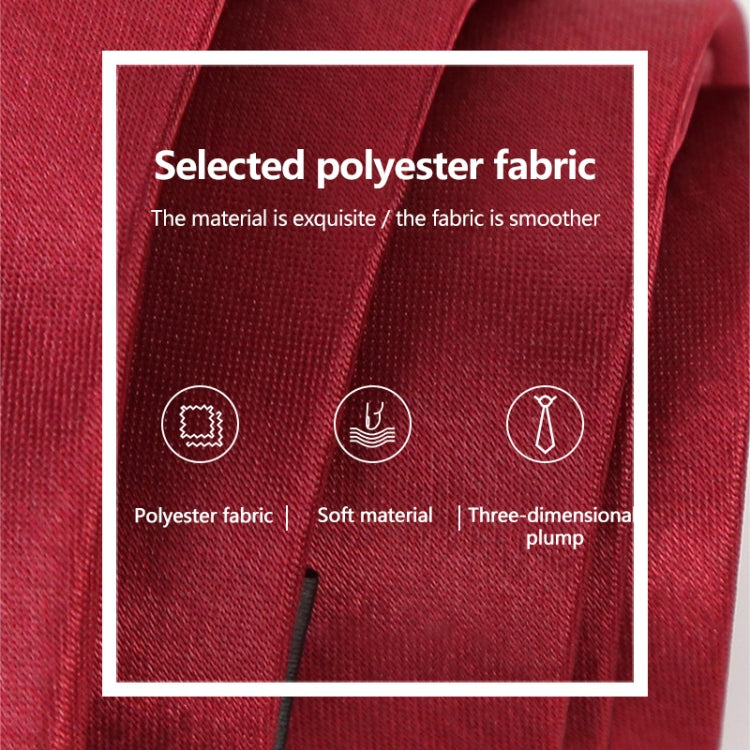 Red slim necktie fabric close-up with textured polyester weave