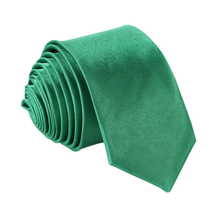 Green slim necktie, narrow width, rolled stack