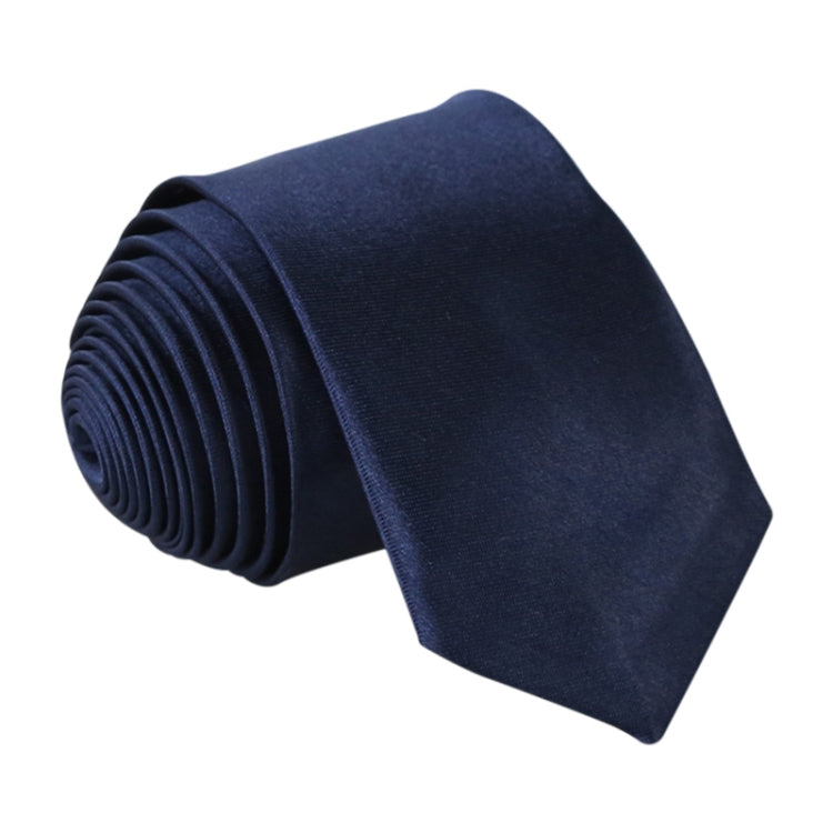 Navy slim necktie, narrow width, rolled stack