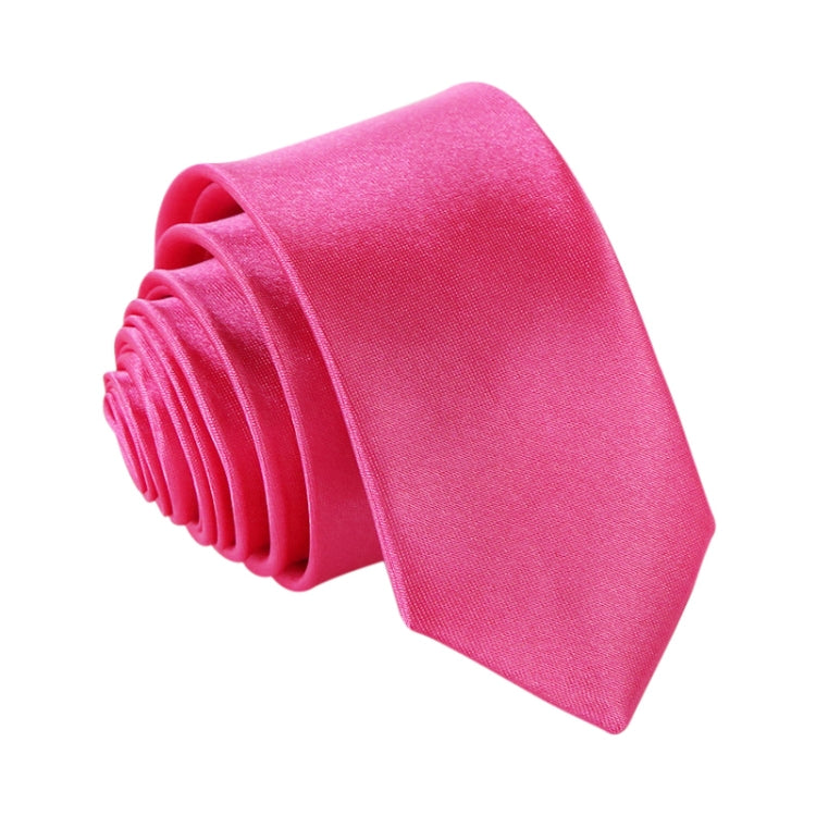 Pink slim necktie, narrow width, rolled stack