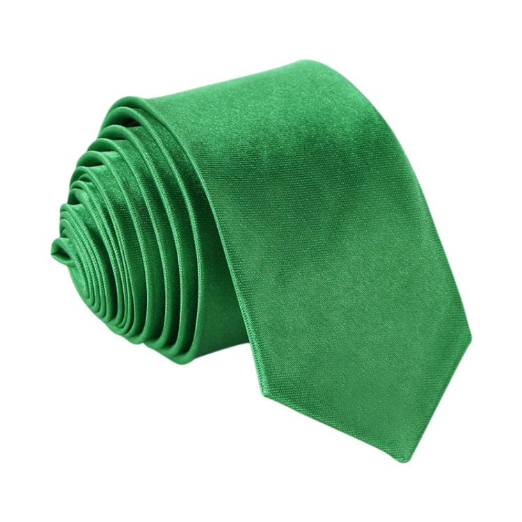 Green narrow necktie, solid color with woven texture and roll-up stack detail