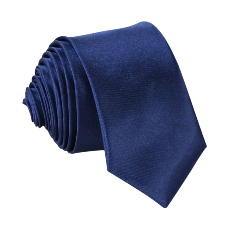 Navy narrow necktie, solid color with woven texture and neatly stacked folds