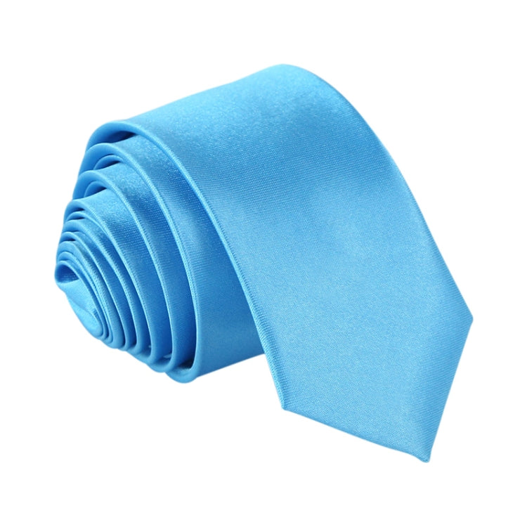 Light blue narrow necktie, solid color with woven texture and bundled folds