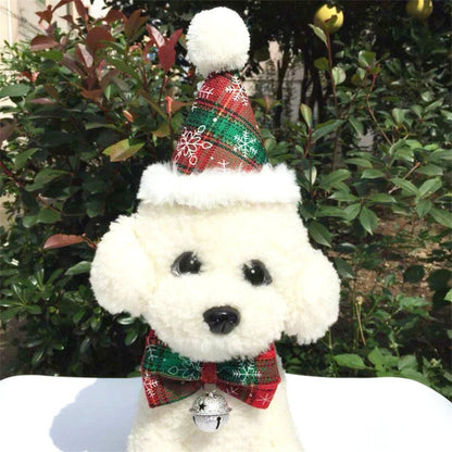 Pet Christmas Santa-style hat and plaid bow tie with silver bell on white dog plush