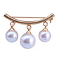 Gold-tone curved brooch with three dangling white pearls and pin backing