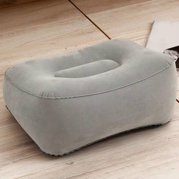 Gray inflatable foot rest pillow, angled view with cup opening