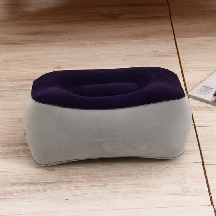 Gray inflatable foot rest pillow with dark blue top insert and cup opening