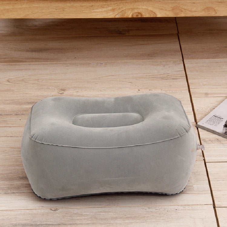 Gray inflatable foot rest pillow, front view with cup opening