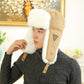Khaki ear-protecting flight hat with white faux fur earmuffs and triangular logo patch