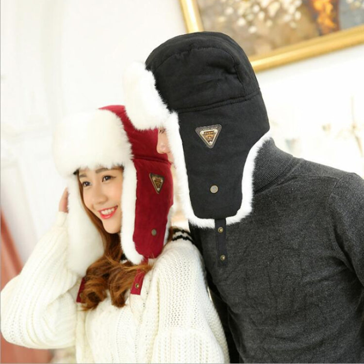 Black earflap winter flight hat with white faux fur earmuffs and triangular logo patch