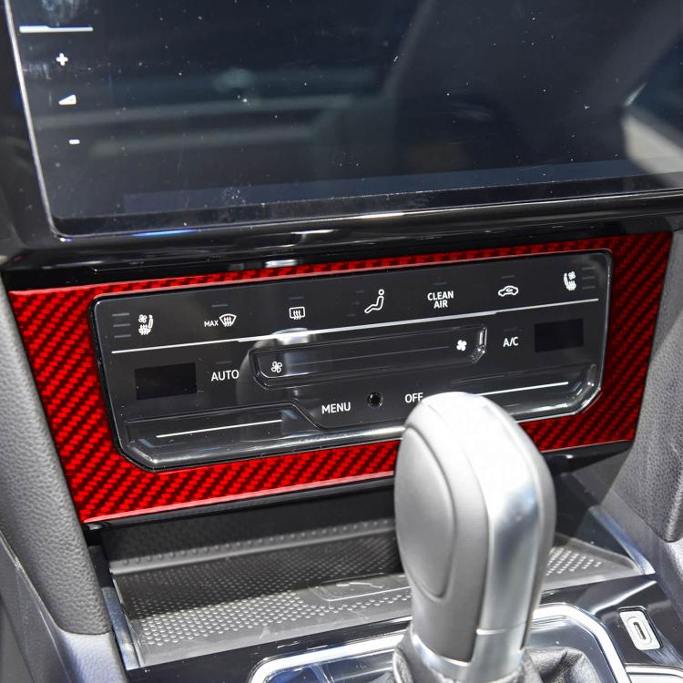 Red carbon-fiber multimedia console trim sticker around vehicle climate controls