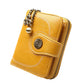 Long golden yellow leather phone wallet with chain handle and zipper, front snap pocket detail