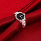 Silver-tone quartz watch ring with black dial and crystal-studded metal band