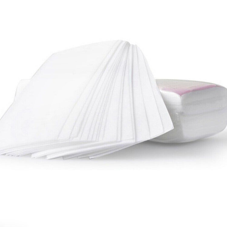 White non-woven wax removal paper sheets, folded stack, for at-home hair removal