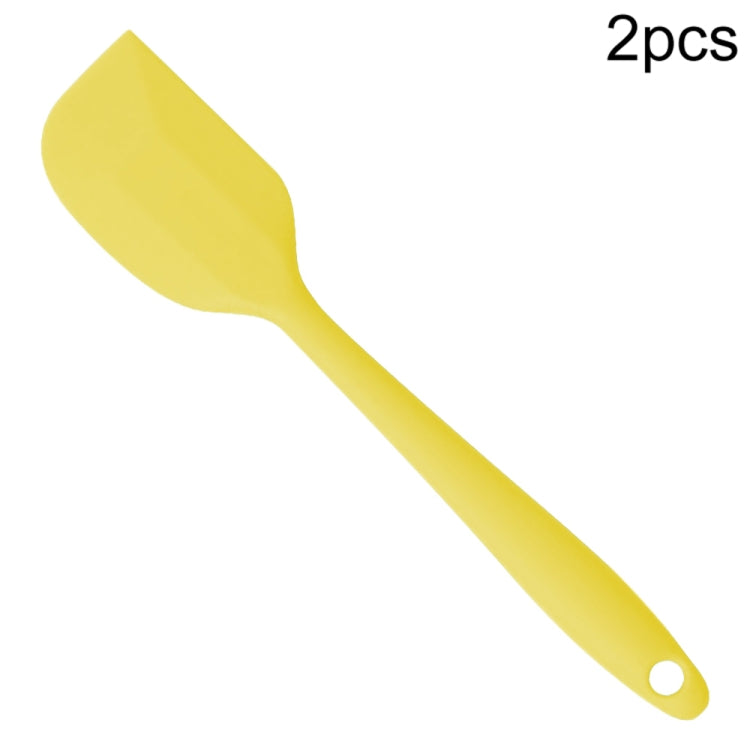 Yellow silicone cake spatula with flat scraper blade and hanging hole