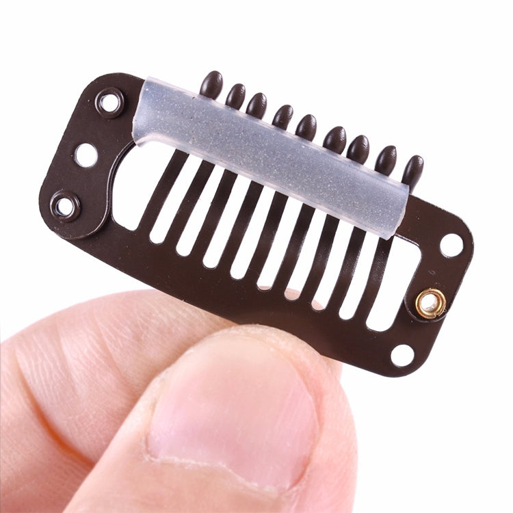 Close-up of a brown 9-tooth hair extension snap clip with metal comb and silicone back