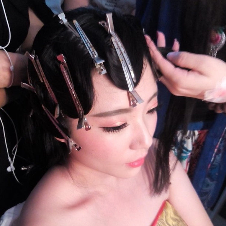 Stainless steel duckbill hair clips in hair, multiple clips secured