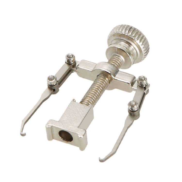 Silver toe nail care clip tool with knurled knob, threaded screw, and prong base