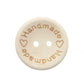 Round natural wooden button with two holes, engraved 'Handmade with love'