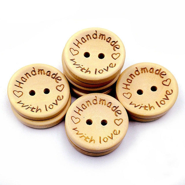 Natural wood buttons set with dark engraved hearts and two holes