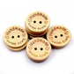 Stack of four natural wood heart buttons with 'Handmade with love' engraving