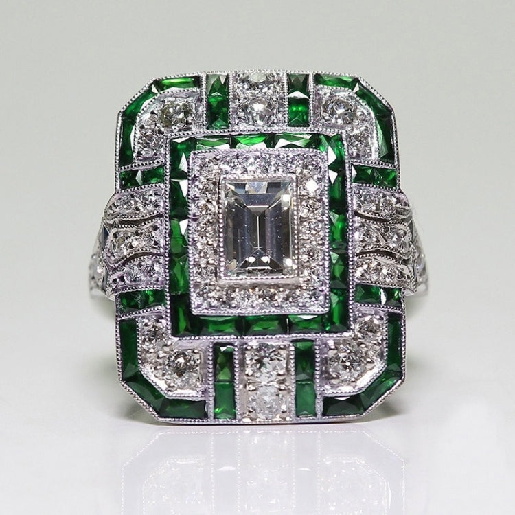 Square-cut crystal halo engagement ring with green gemstone accents, silver-tone setting