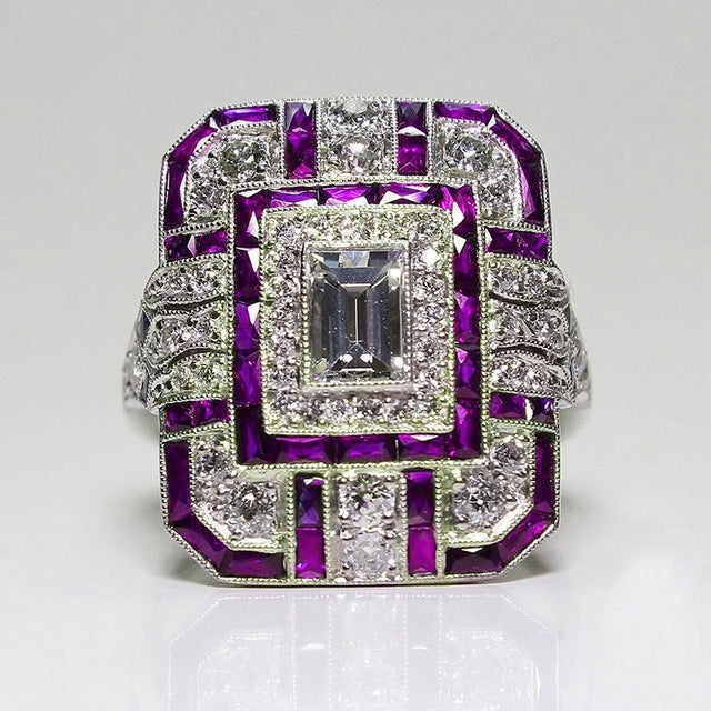 Square crystal zircon engagement ring with purple accents and clear center stone