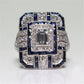 Square crystal zircon engagement ring with clear center stone and blue accents