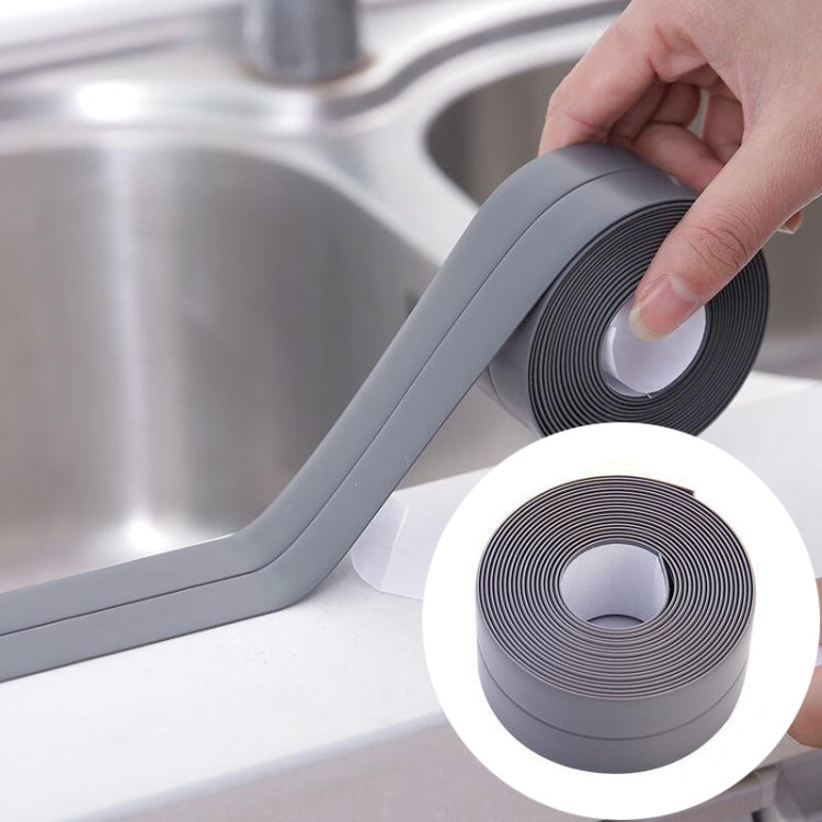 Grey waterproof adhesive sealing tape being applied, with matching grey roll inset