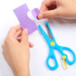 Blue safety scissors with yellow pivot, held with hands for crafting paper